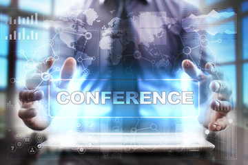 Businessman using tablet pc and selecting conference.