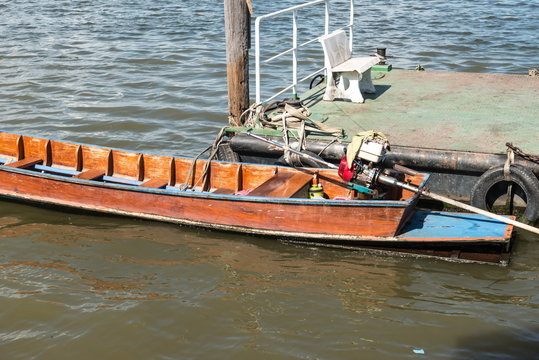 Small fast wooden boat on a river