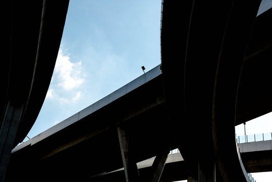 Silhouette of highway ramps on a sunny day