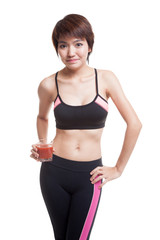 Beautiful healthy Asian girl with tomato juice.