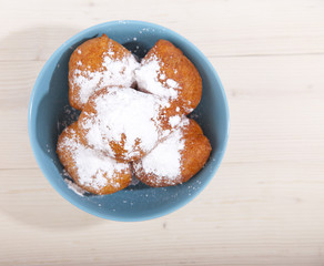 Traditional Dutch oliebollen on wooden background