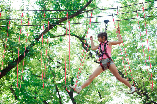 adventure climbing high wire park - hiking in the rope park girl - Powered by Adobe