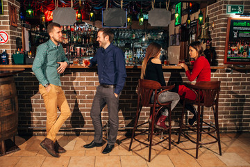 Fototapeta na wymiar bar,two men talking, friends drink