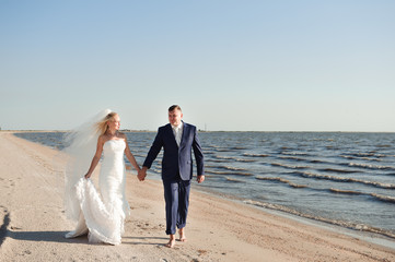 couple in love on the beach on their wedding day