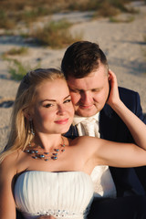 Bride and groom by the sea on their wedding day