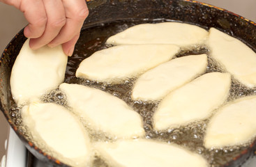 patties are fried in a pan