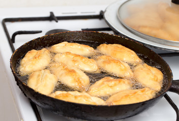patties are fried in a pan