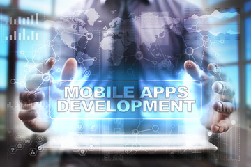 Businessman using tablet pc and selecting mobile apps development.