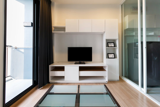 Living Room, White Wallpaper With Furniture On Wooden Floor, Wide Angle View.