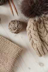 Fototapeta premium tangles of thread and knit cap on the table