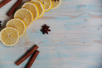 lemon, cinnamon, anise on a wooden table