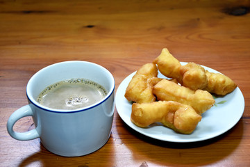 deep-fried dough stick with coffee. Eating breakfast is very good energy