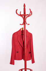 Red jacket hanging on a coat stand