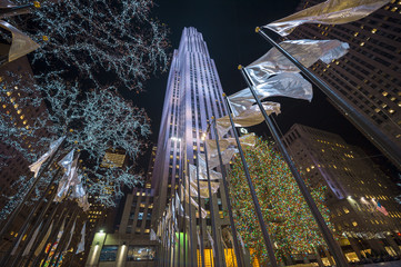 Holiday flags fly in a night cityscape Christmas scene in New York City