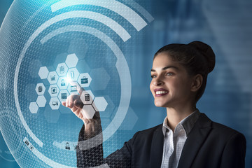 modern business woman using innovative technologies to manage her administrative work, using a...