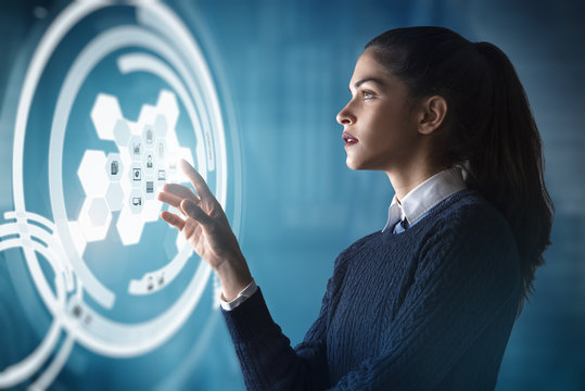 Modern Business Woman Using Innovative Technologies To Manage Her Administrative Work, Using A Digital Hologram Erp System