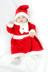 Portrait of adorable baby girl with santa costume. Isolated on w