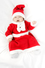 Portrait of adorable baby girl with santa costume. Isolated on w
