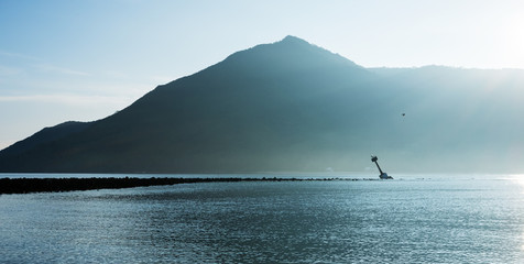 Tilted beacon on the soft scenery seascape background