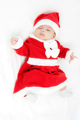 Portrait of adorable baby girl with santa costume. Isolated on w