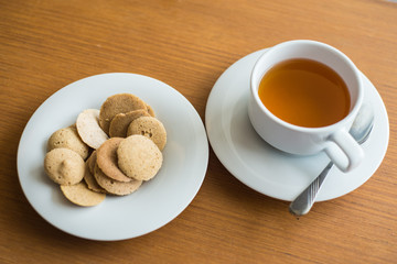 Afternoon Tea and Banana Rice Berry Crispy on the white table