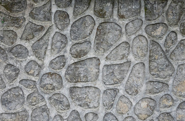 Wall decorated with cemented stones.