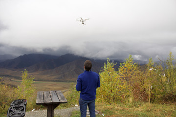 A traveler from drones in the mountains