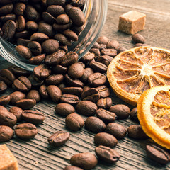 Coffee beans into glass jar table with sugar and anise