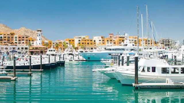 Luxury Yachts and Boats in the Cabo San Lucas Mexico Harbor Marina during a Sunny Day with Perfect Weather in the Mexican Riviera
