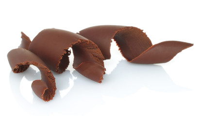Chocolate shavings on white background.