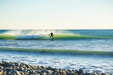Surfing in the winter, and ocean wave
