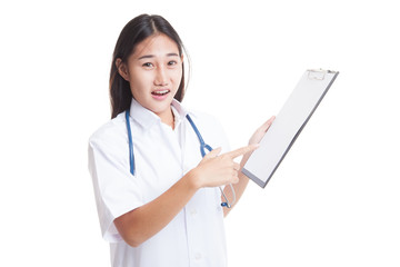 Asian young female doctor upset  point to blank clipboard.