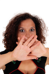 Shocked woman with hand over mouth.