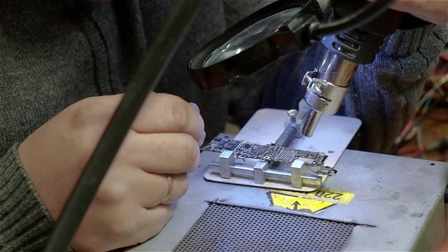 White male setup chips in motherboard smartphone iphone