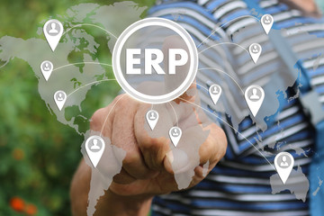 Farmer businessman pressed a button ERP enterprise resource planning on the touch screen . The concept of human resources in the network , access control,customer relationship management. 