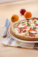 Tart with salted sheep cheese and tomatoes