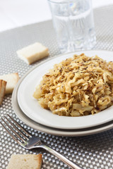 Fried cabbage with caraway and garlic on a plate
