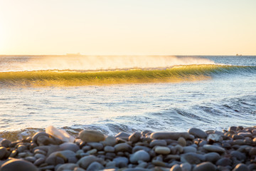 Waves and sunset on ocean