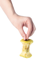 the stub of a green apple in woman hand