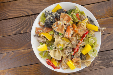 appetizing colored farfalle pasta with vegetables