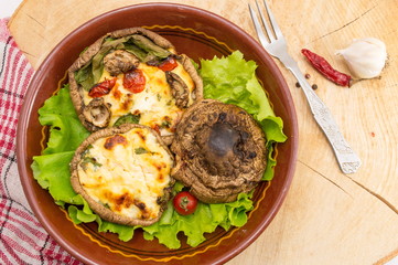 cheese stuffed mushrooms on a plate