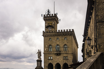 Liberty statue and Public Palace on Town hall square in San Marino state castle, Italy