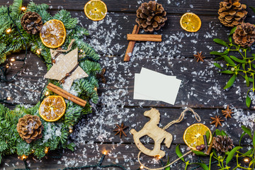 Christmas decoration with paper card on wooden background