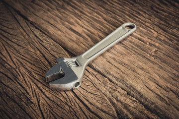 Wrench on wooden background