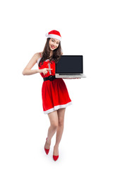 Asian Christmas girl with Santa Claus clothes holding laptop iso