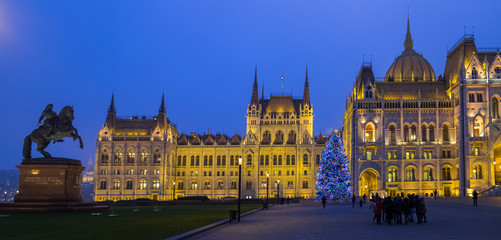 Fototapeta na wymiar Panoramic view of Beautiful illuminated Budapest parliament at l