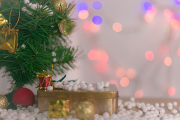Gift boxes and ornaments in Merry Christmas and Happy New Year concept with bokeh background, can be use for make a greeting cards.