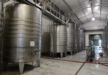 Naklejka na ściany i meble Fermentation tanks stainless steel for wine at the winery 