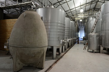 Fermentation tanks stainless steel for wine at the winery  © b201735