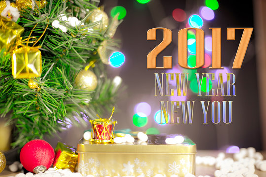 Merry Christmas and Happy New Year text with gift boxes and ornaments in white bokeh background